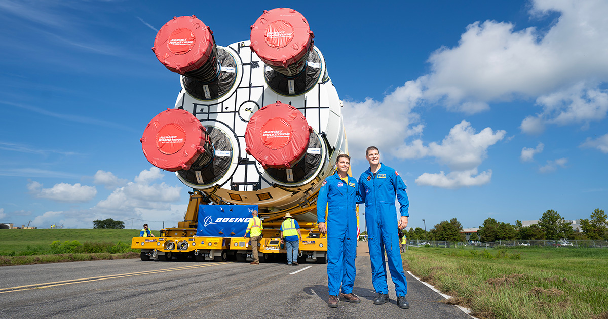 Jeremy and Reid posing in front of the SLS core stage