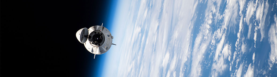 View of the International Space Station from SpaceX's Crew Dragon Endeavour spacecraft, with the Earth in the background.