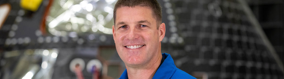 Jeremy smiles in front of the Orion capsule.