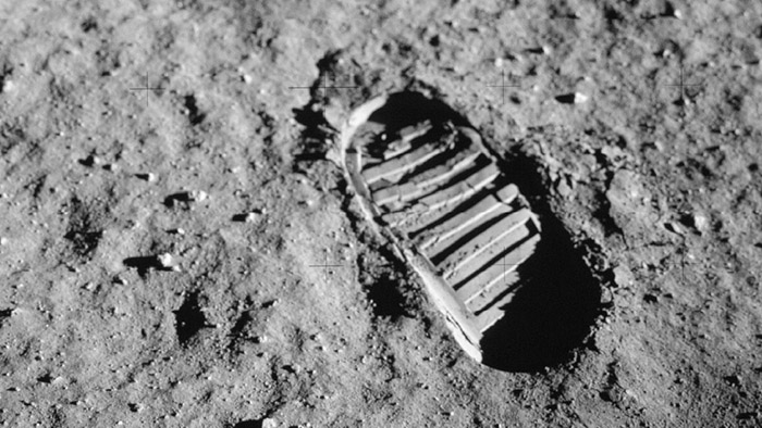 A bootprint on the gray surface of the Moon