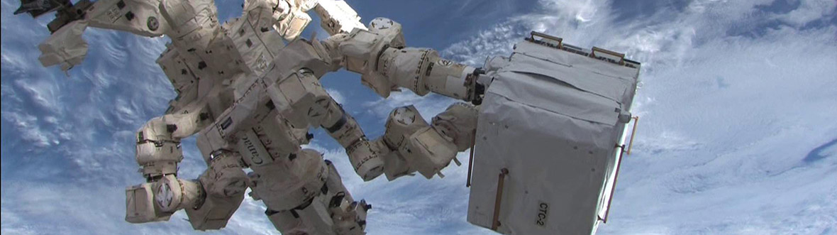 Dextre transfers materials from the HTV-2 cargo ship to the International Space Station