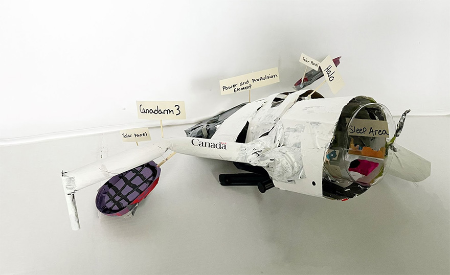 Model with solar panels, HALO, Canadarm3, power and propulsion element and sleep area