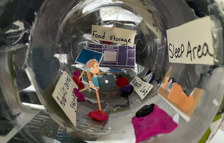 Model with sleep area next to robotics control station, research lab and food storage