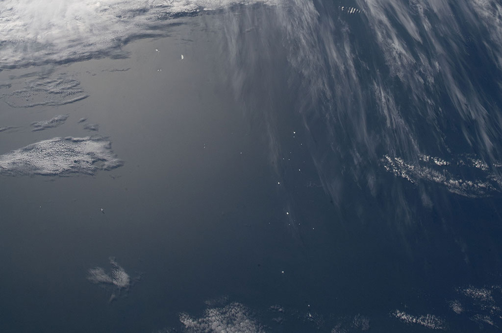 The small white dots are large icebergs captured by David Saint-Jacques from the International Space Station. (Credit: Canadian Space Agency/NASA)