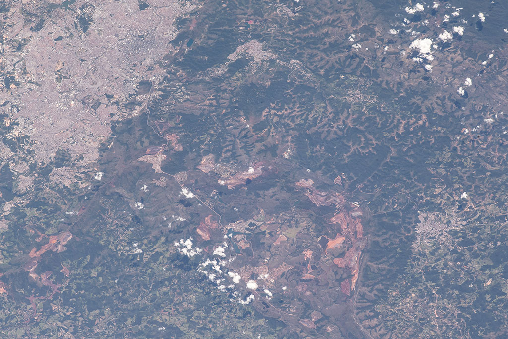 On January 25 2019, a tailings dam collapsed at an iron ore mining site in the town of Brumadinho in southeastern Brazil. This photo of the area was taken by an astronaut aboard the International Space Station on February 2, 2019. The landslide is visible in the bottom right corner. (Credit: NASA)