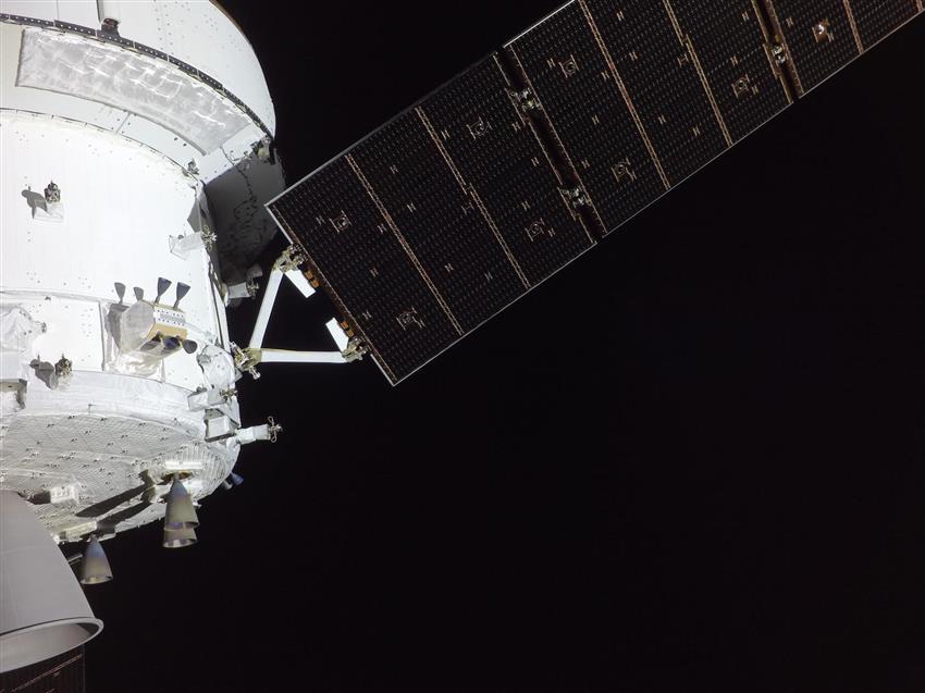 Close-up of the Orion spacecraft and one of its solar array wings.