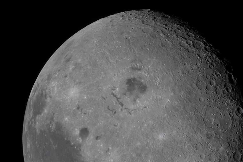 The Moon with a distinctive crater and dark patch in the middle. 