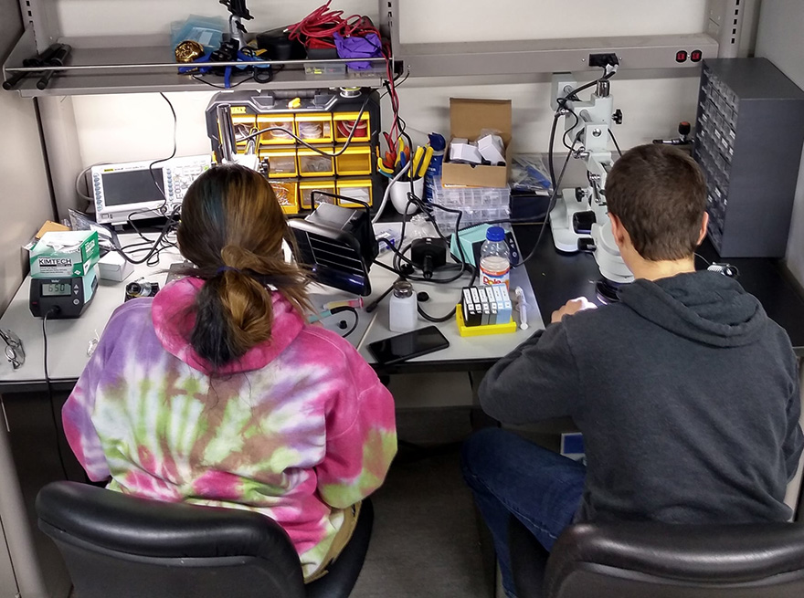 Two people from Aurora College team