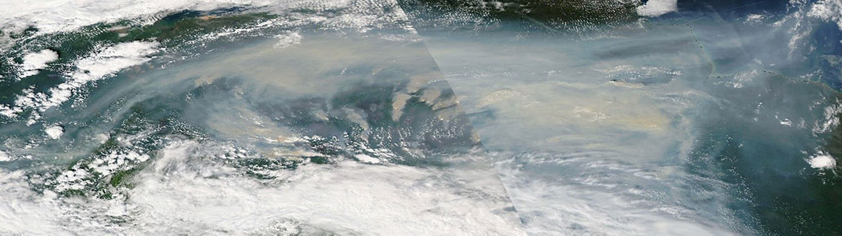 Smoke over a landscape, as seen from space.